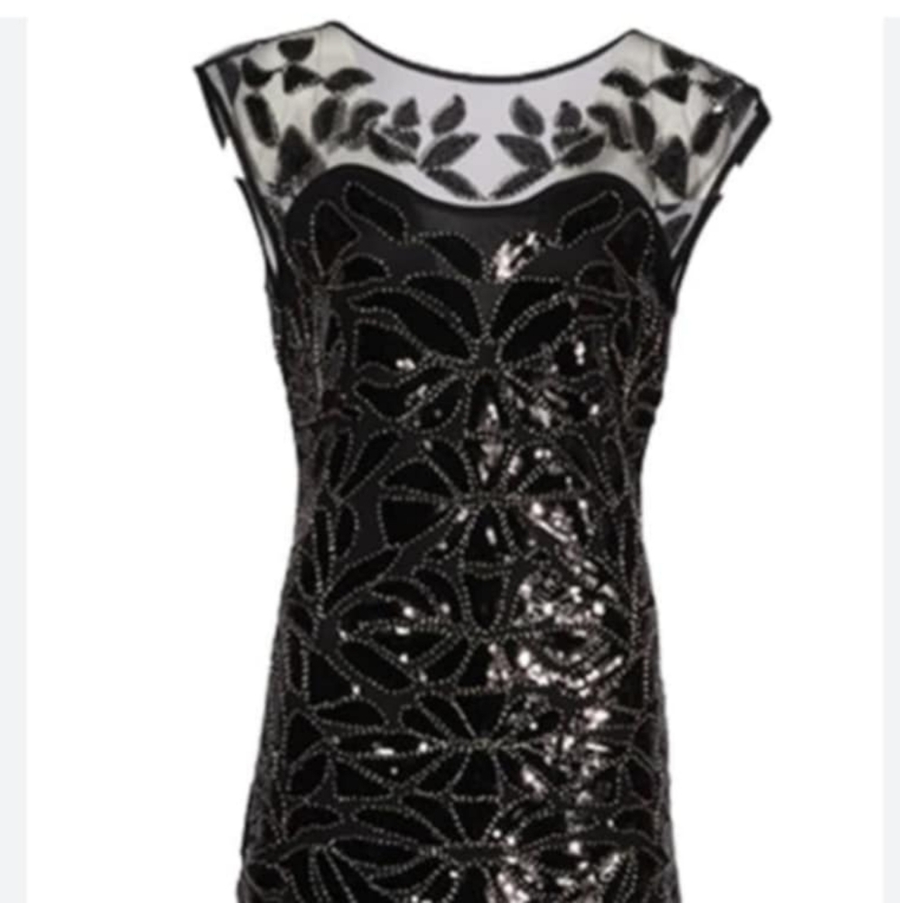 Beautiful sheer sequenced black flowing evening gown.